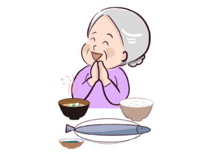 楽しげに食事をするお婆さん